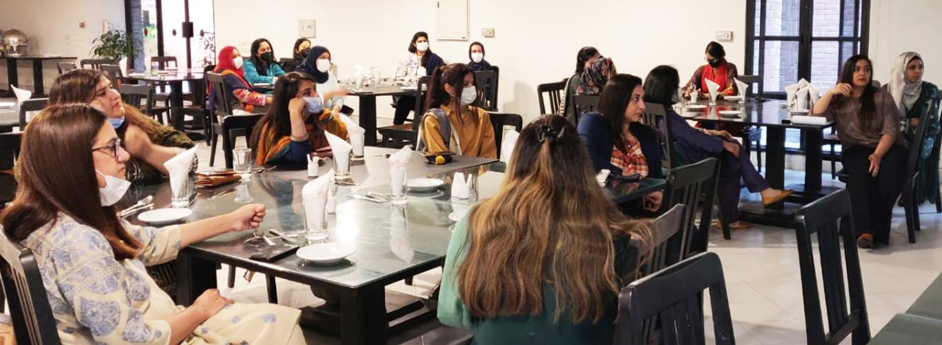 Participants sitting in the executive dining hall 